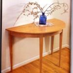 Demilune Table: 2003 Cherry 40” wide, 19” deep, 29” tall $500